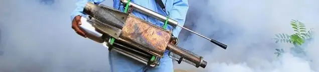 Fumigation technician using a fogger for deep pest treatment in New Orleans, LA